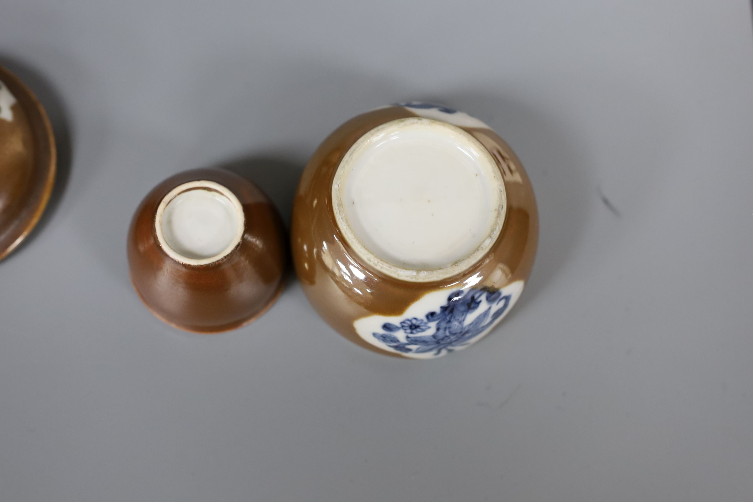 A Chinese cafe au lait glazed saucer, three bowls and a stem cup